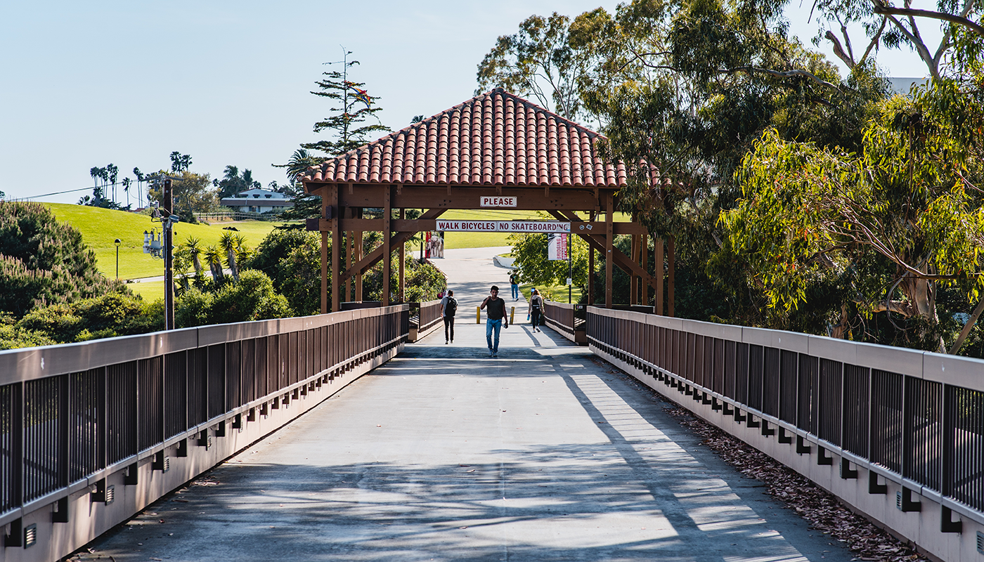 SBCC students walking on the bridge.